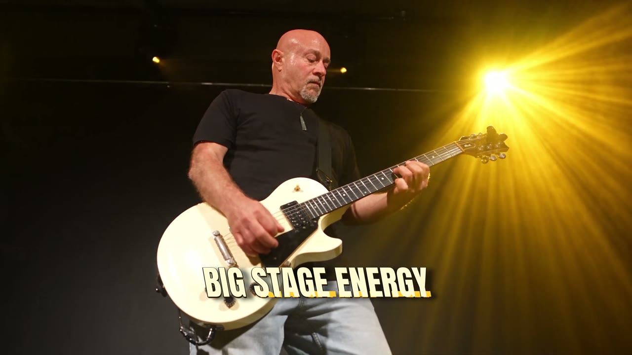 Live guitarist performing in a golden spotlight