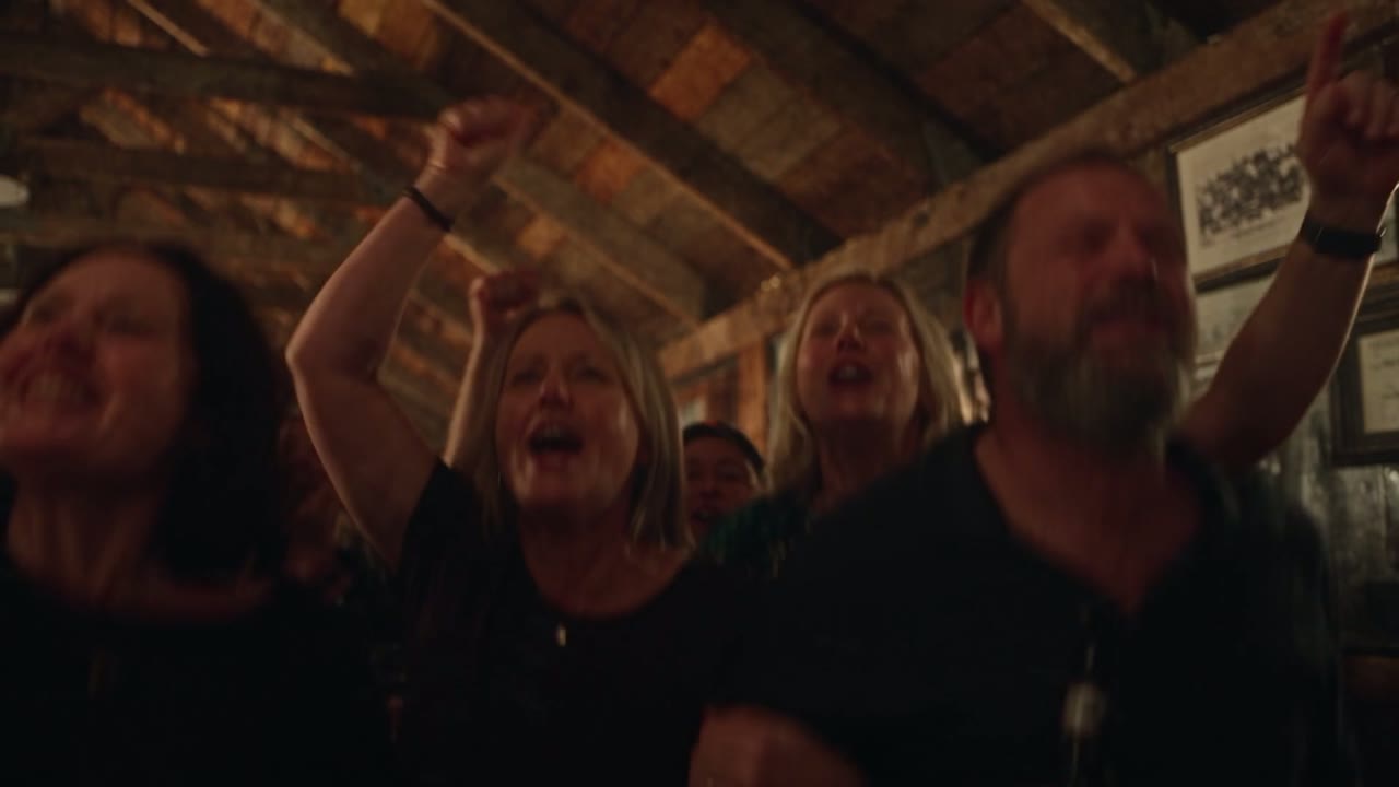 Audience singing along at an Amplified show
